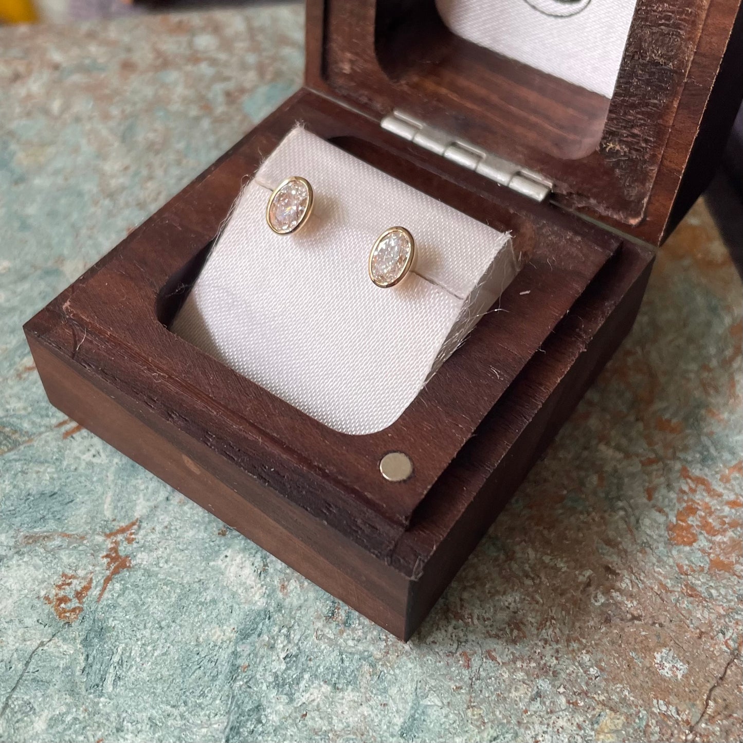 Oval Cut Diamond bezel set earrings