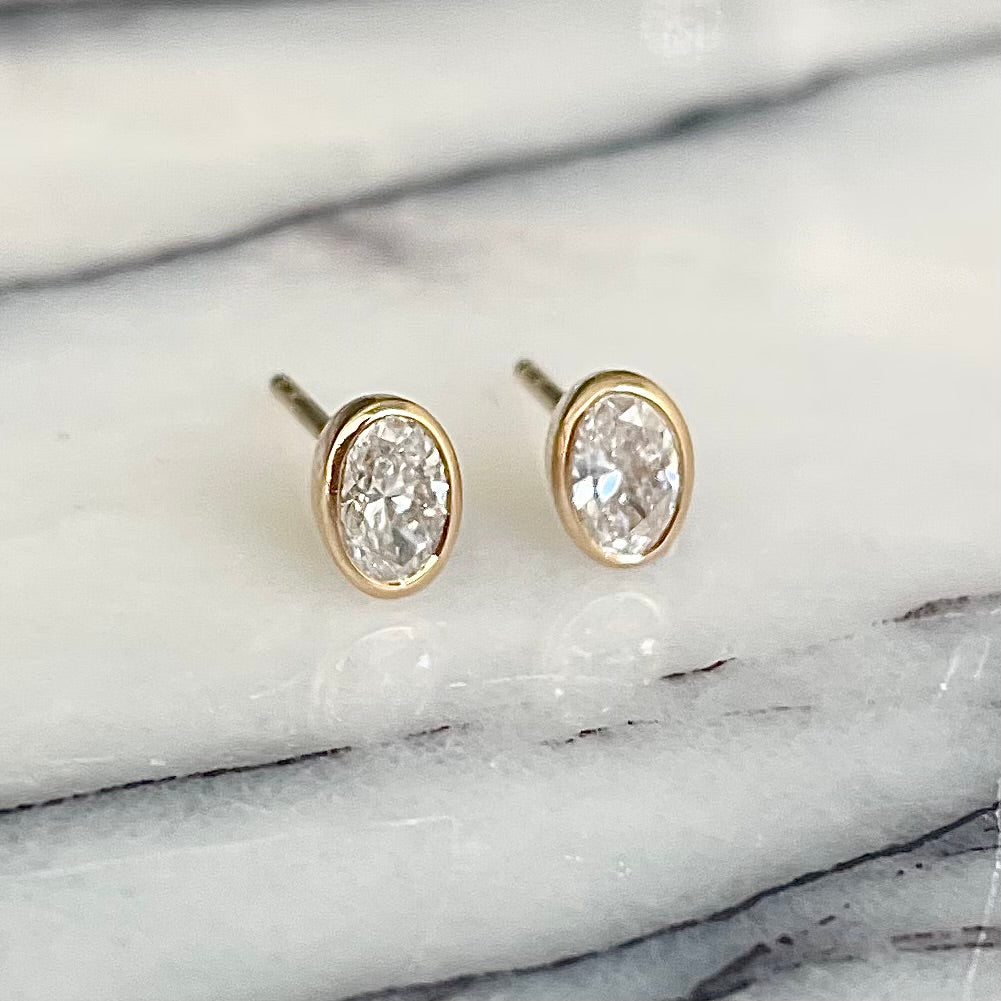 Oval Cut Diamond bezel set earrings