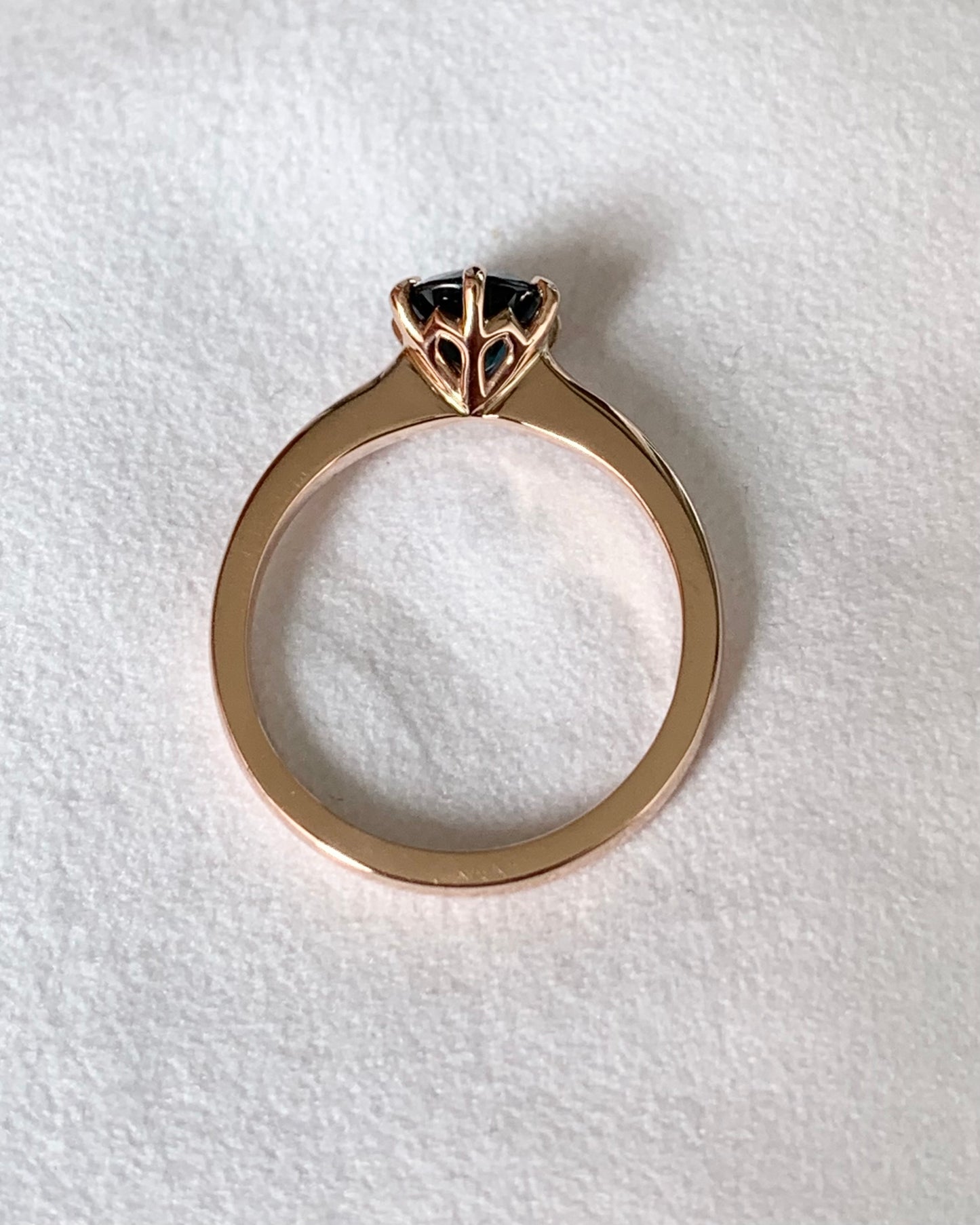This 14ct Rose Gold Solitaire Chloe Ring is beautifully complimented by a 1.09ct teal blue Australian Sapphire, the stone is set with six eagle shaped claws in Rose gold. The Sapphire measures 6.14ct and is 1.09cts The ring is size L & can be sized to sizes I-R Made with recycled metal in Sydney Ethically sourced Gemstones