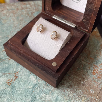 Oval Cut Diamond bezel set earrings