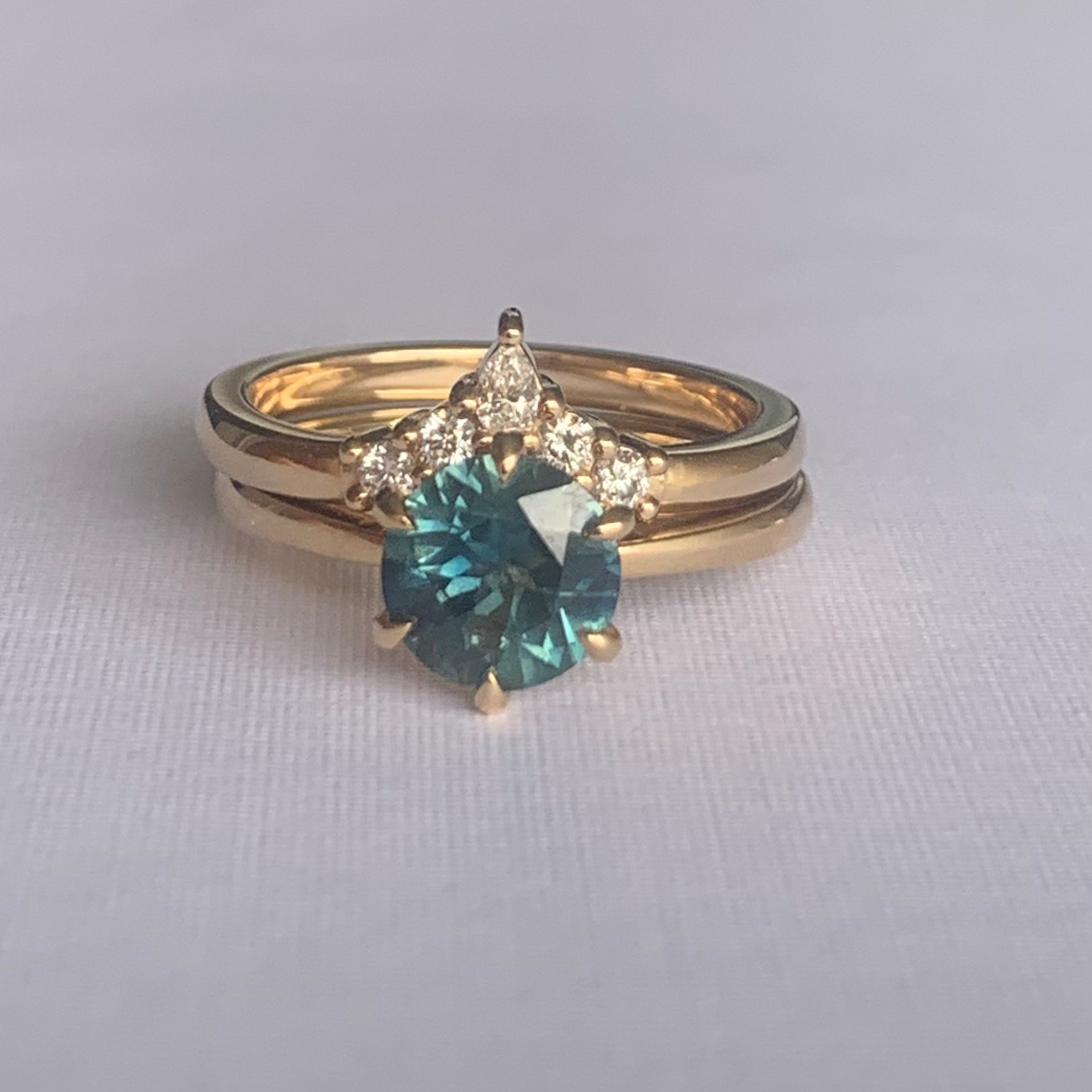Viola Diamond V Band  Band width 2mm  Finger Size O  14ct Yellow Gold  Complimentary first Size  The Diamonds are Colour F clarity VS featuring four 2mm round brilliant cuts and one 4 x 2mm pear cut diamond.  Made with recycled metal in Sydney   Ethically sourced Gemstones 