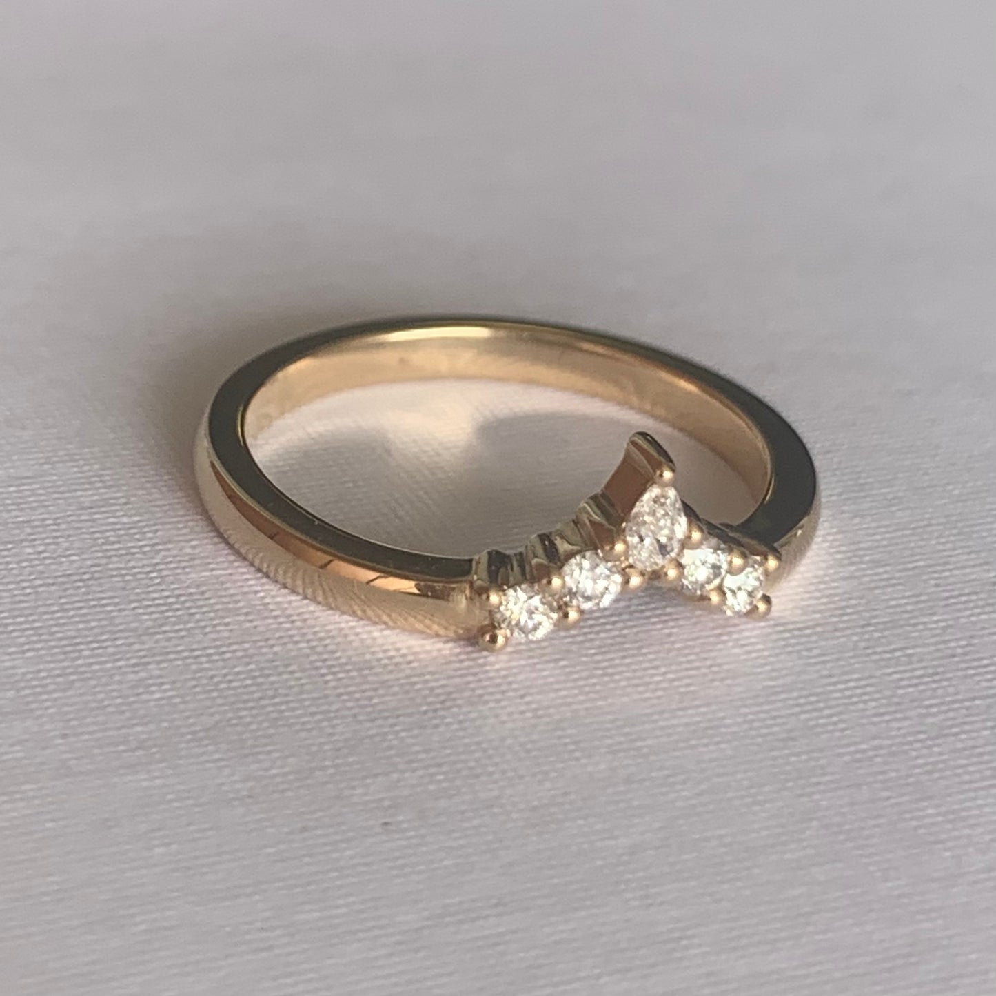 Viola Diamond V Band  Band width 2mm  Finger Size O  14ct Yellow Gold  Complimentary first Size  The Diamonds are Colour F clarity VS featuring four 2mm round brilliant cuts and one 4 x 2mm pear cut diamond.  Made with recycled metal in Sydney   Ethically sourced Gemstones 