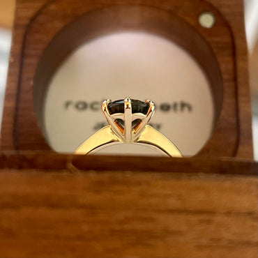 This 14ct Yellow Gold Solitare Chloe Sapphire Ring featuring a Light Blue Australian Parti Sapphire and is set with 6 claws. The band is pinched at the top, the claws are set in an eagle claw shape   The Sapphire measures 7.5mm & is 1.69ct in weight  This ring is a size L (it can be resized I-Q)   Made with recycled metal in Sydney   Ethically sourced Gemstones 
