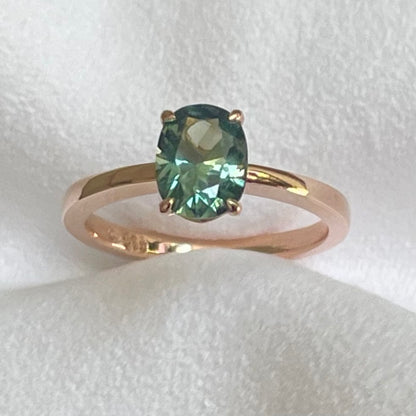 This 14ct Rose Gold Solitaire Eva Ring is beautifully complimented by a 1.33ct oval cut Australian Parti Sapphire, the stone is set with four eagle shaped claws in Rose gold. The Sapphire measures 7.7 x 5.9mm The ring is size L & can be sized to sizes I-R Made with recycled metal in Sydney Ethically sourced Gemstones