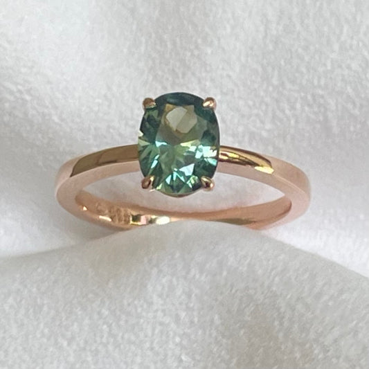 This 14ct Rose Gold Solitaire Eva Ring is beautifully complimented by a 1.33ct oval cut Australian Parti Sapphire, the stone is set with four eagle shaped claws in Rose gold. The Sapphire measures 7.7 x 5.9mm The ring is size L & can be sized to sizes I-R Made with recycled metal in Sydney Ethically sourced Gemstones