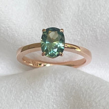Load image into Gallery viewer, This 14ct Rose Gold Solitaire Eva Ring is beautifully complimented by a 1.33ct oval cut Australian Parti Sapphire, the stone is set with four eagle shaped claws in Rose gold. The Sapphire measures 7.7 x 5.9mm The ring is size L &amp; can be sized to sizes I-R Made with recycled metal in Sydney Ethically sourced Gemstones