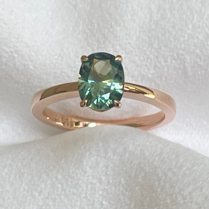 This 14ct Rose Gold Solitaire Eva Ring is beautifully complimented by a 1.33ct oval cut Australian Parti Sapphire, the stone is set with four eagle shaped claws in Rose gold. The Sapphire measures 7.7 x 5.9mm The ring is size L & can be sized to sizes I-R Made with recycled metal in Sydney Ethically sourced Gemstones