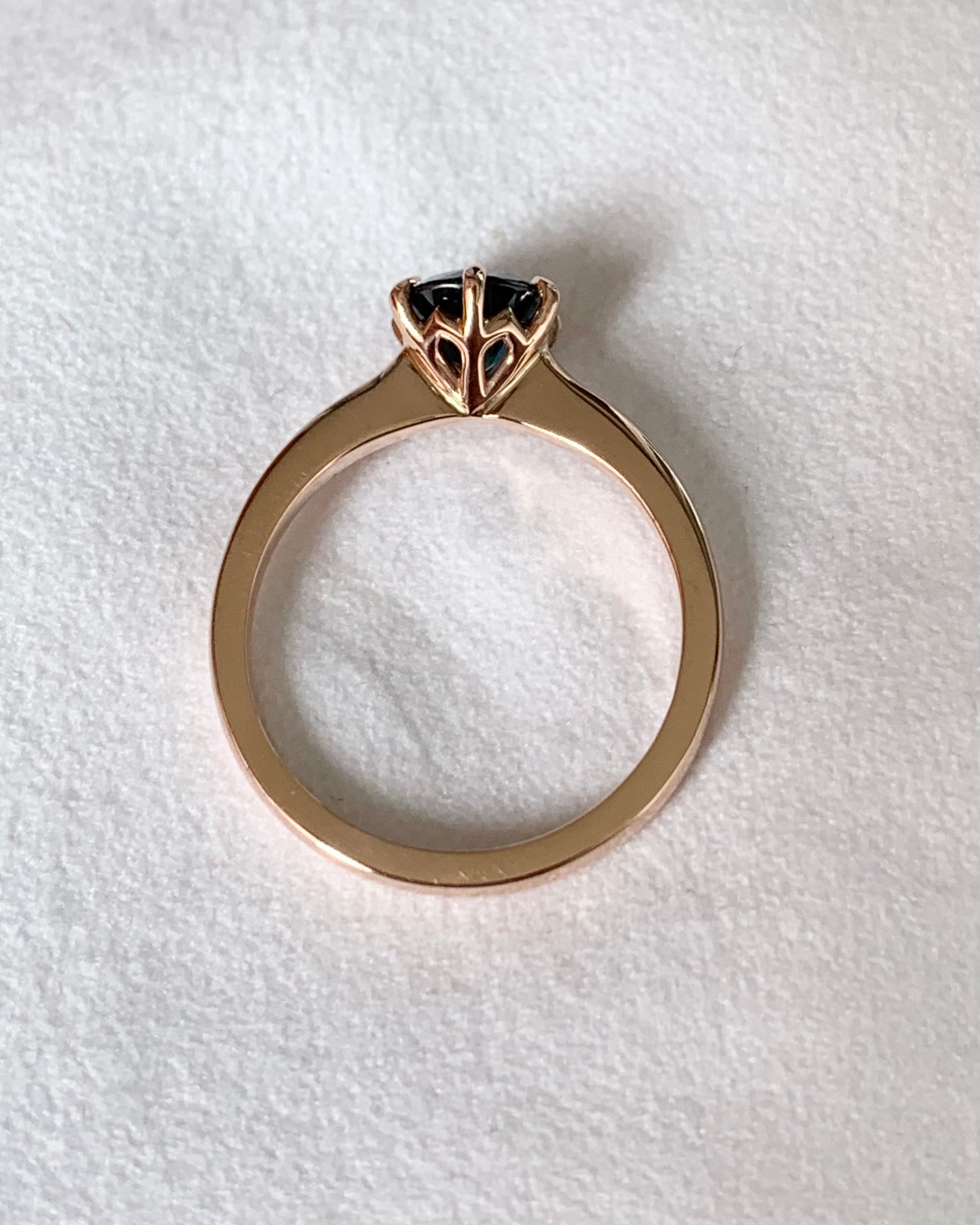 This 14ct Rose Gold Solitaire Chloe Ring is beautifully complimented by a 1.09ct teal blue Australian Sapphire, the stone is set with six eagle shaped claws in Rose gold.  The Sapphire measures 6.14ct and is 1.09cts   The ring is size L & can be sized to sizes I-R   Made with recycled metal in Sydney   Ethically sourced Gemstones 
