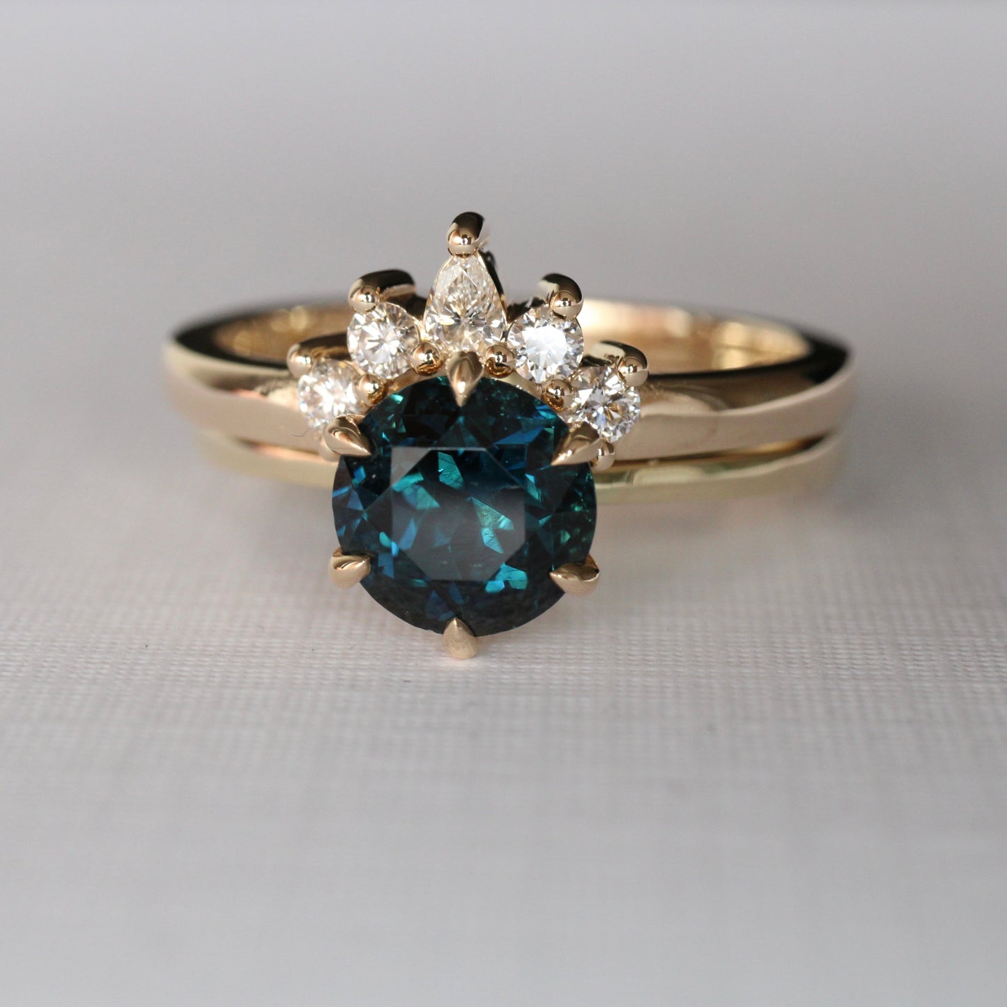 Cara Diamond Arch Band  Band width 2mm  Finger Size O  Complimentary First Size  14ct Yellow Gold  The Diamonds are Colour F clarity VS featuring four 2mm round brilliant cuts and one 3 x 2mm pear cut diamond.  Made with recycled metal in Sydney   Ethically sourced Gemstones 