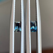 Load image into Gallery viewer, A radiant pair of teal blue Australian sapphires measuring 4.8 x 3mm total weight=0.60ct   Our stones have been ethically sourced from reputable stone merchants. We can also source a variety of stones for you if you have something specific in mind  All photos and videos are taken with natural light   Available for custom making, email for more details    rachel@rachelbethjewellery.com.au